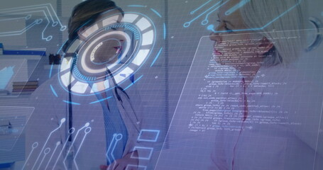 Discussing doctor and patient examining holographic UI display in clinic room, stethoscope, binders
