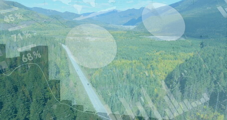Showing aerial two-lane highway cutting through evergreen forest, with data visualization overlays