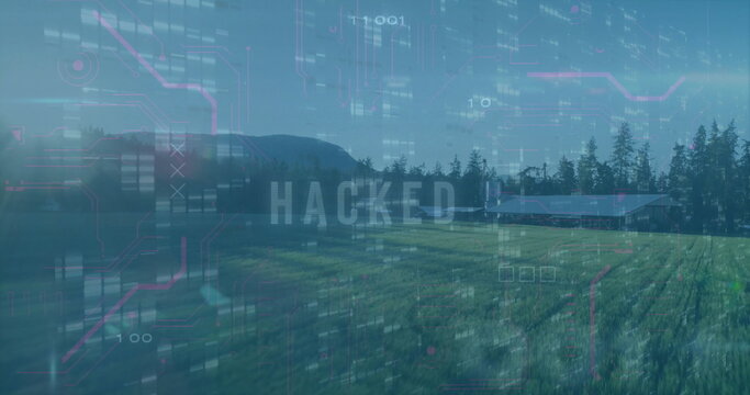 Fototapeta Displaying digital glitch overlay over grassy farm field, with barn, trees, ridge and HACKED code