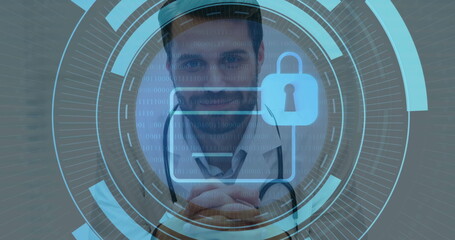 Standing male doctor presenting secure records on digital interface in clinic, with padlock icon