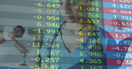 Provider with stethoscope monitoring patient in hospital, with bed phone and financial overlay