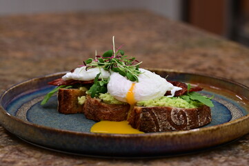close up serving avocado toast with egg