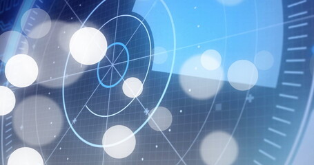 Displaying circular radar interface rotating over dark grid on screen, with glowing orbs and bokeh