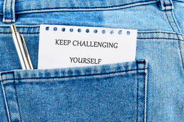 Personal growth concept. Words KEEP CHALLENGING YOURSELF