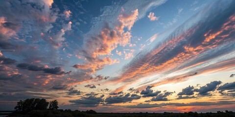 Breathtaking Sunset Sky with Dramatic Clouds and Golden Light Over Landscape