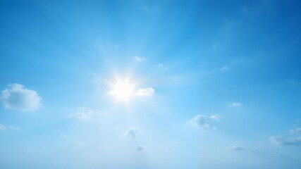 Fototapeta premium Sun shining brightly in sky with few clouds