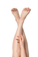 Woman's legs with hand isolated on white background. Well-groomed toes.