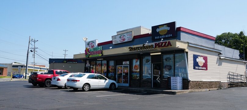 Wilmington, Delaware - July 12, 2025 - The exterior view of the Barcelona Pizza and Paleteria Tocumbo ice cream shop on Old Capitol Trail
