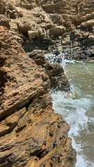 Rocky Coastline and Gentle Sea Waves – Tranquil Nature Background
