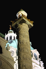 St. Charles's Church, baroque landmark in Vienna, Austria, illuminated at night.
