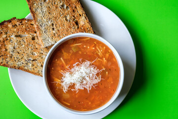 Italian Style Minestrone Soup Topped With Cheese Seved With Toast