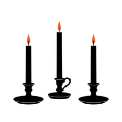 Elegant black candle holders with lit candles on white background for decoration and ambiance
