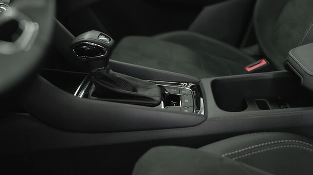 Modern car interior showing automatic gear stick and controls