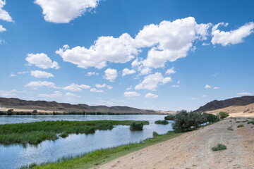 Steppe landscape in the Ili River valley near Almaty, with a beautiful sky in the clouds