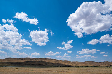 Steppe landscape in the Ili River valley near Almaty, with a beautiful sky in the clouds