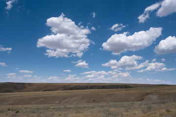 Steppe landscape in the Ili River valley near Almaty, with a beautiful sky in the clouds