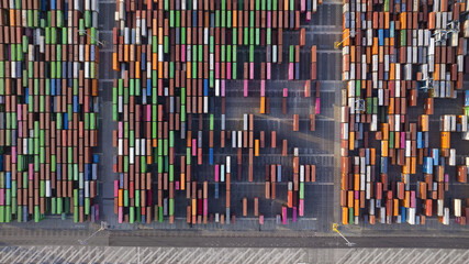 Long Beach, United States - 04 July 2025: Aerial view of a vibrant tapestry of shipping containers, their varied hues painting an industrial landscape with blocks of color.