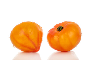 Ripe juicy tomatoes isolated on white background, close-up.