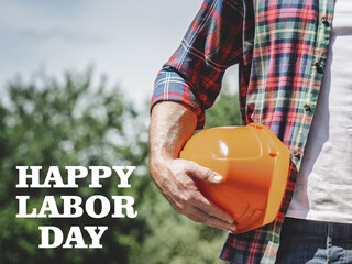 Happy Labor Day. Handsome man and angle grinder. Closeup, outdoors. Sun day, Congratulations for...