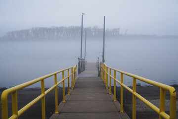 Obraz premium A Dock Against the Fog by a River in Illinois