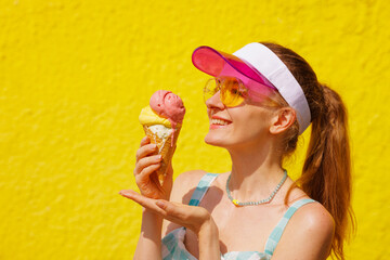 Cheerful Woman Enjoying Ice Cream Cone on a Bright Summer Day Outdoors