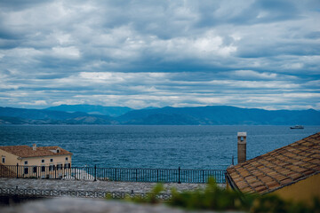 Scenic Sea View with Mountains and Cloudy Sky