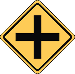 Obraz premium Yellow diamond road sign with black cross symbol indicating intersection ahead.