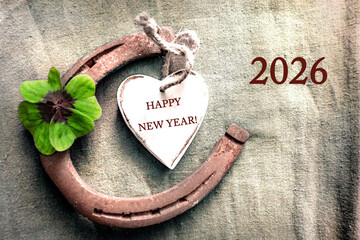 2026 Happy NEW YEAR decoration with four leaf clover and horseshoe with text	
