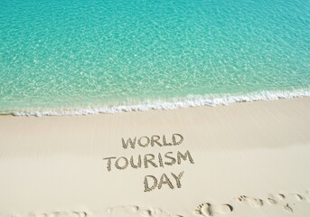 World tourism day message written in sand on a tropical beach