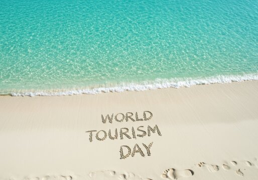 World tourism day message written in sand on a tropical beach - Powered by Adobe