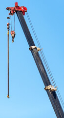 Crane hook in blue sky background