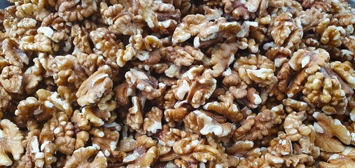 Description:
Close up background of shelled walnut kernels. A pile of the raw, healthy superfood, rich in nutrients for a vegan diet, baking, and healthy snacking.