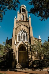Historic Gothic church facade under blue sky.