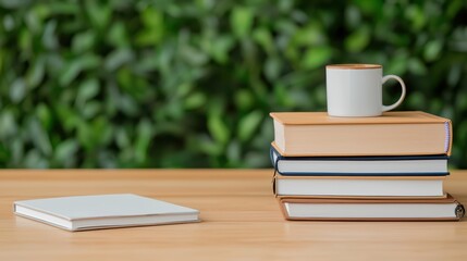 Naklejka premium Cozy Workspace with Stack of Books and Cup on Wooden Table Surface
