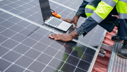Service engineer checking solar cell on the roof for maintenance if there is a damaged part....