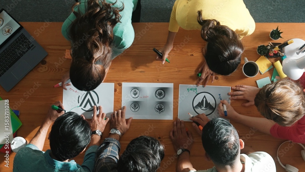 Poster top view of smart business team put graphic logo on meeting table and start to design while explain 