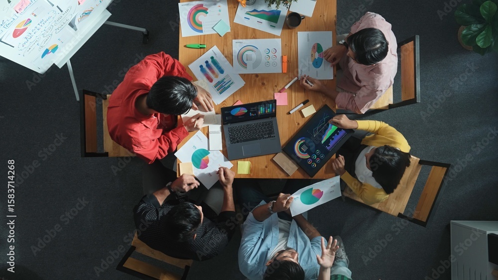 Aufkleber top view of business team working together while talking about financial chart. close up of skilled 