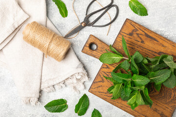 Mint. Fresh organic mint leaves on wooden background. Mint leaves. Peppermint. Close-up. Space for text. Copy space.