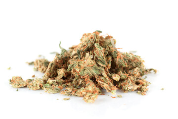 Street drug: pressed marijuana buds isolated on white