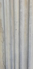 Vertical stone texture with fluted architectural pattern. Ideal for backgrounds, architectural references, 3D modeling, or surface design.