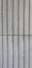 Vertical stone texture with fluted architectural pattern. Ideal for backgrounds, architectural...