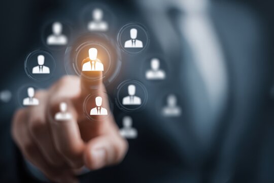 Customer relationship management concept with digital interface highlighting user profiles by a business professional in formal attire