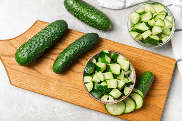 Cucumber on wooden background. Slice of cucumber on background. Fresh organic green cucumbers...