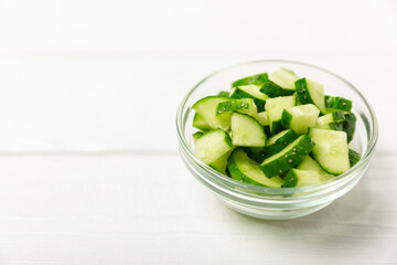 Cucumber on wooden background. Slice of cucumber on background. Fresh organic green cucumbers...