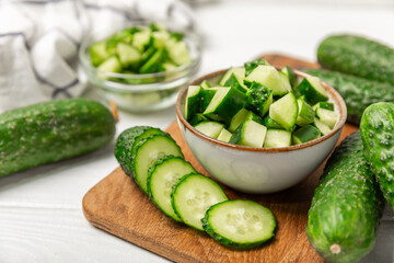 Cucumber on wooden background. Slice of cucumber on background. Fresh organic green cucumbers...