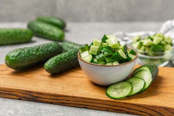 Cucumber on wooden background. Slice of cucumber on background. Fresh organic green cucumbers...