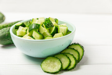 Cucumber on wooden background. Slice of cucumber on background. Fresh organic green cucumbers...