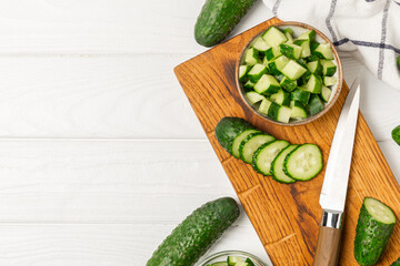 Cucumber on wooden background. Slice of cucumber on background. Fresh organic green cucumbers...