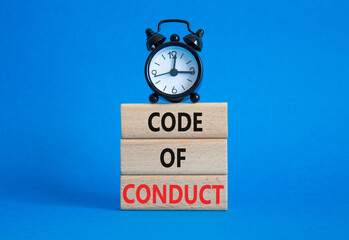 Code of conduct symbol. Wooden blocks with words Code of conduct with alarm clock. Beautiful blue...