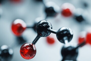 Close up view of a molecular model showcasing black and red atoms representing complex chemical structures in a lab setting